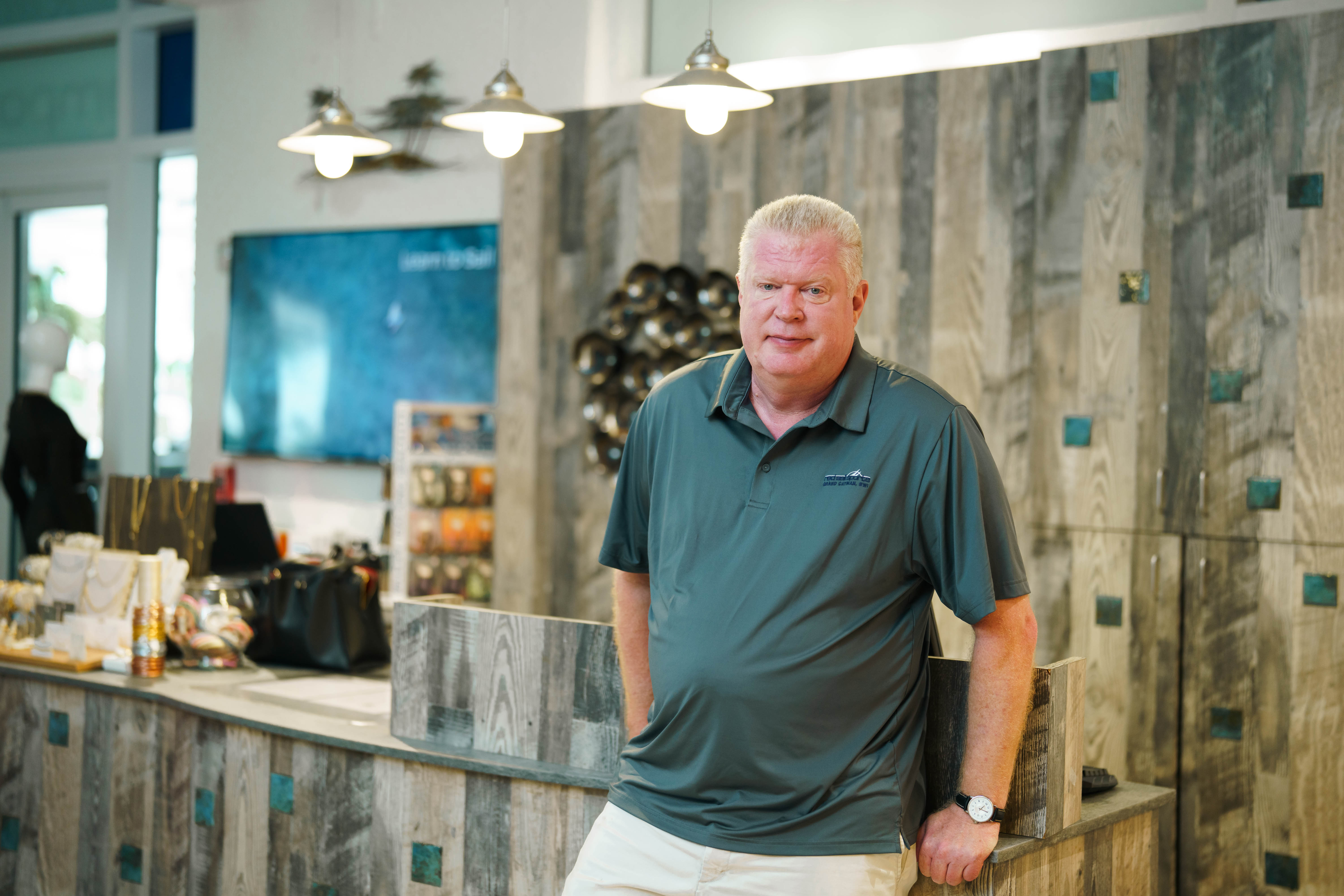 Red Sail Sports Retail Manager Jim Beisel has been a part of the Camana Bay community since planning began for Red’s Emporium, on the Crescent, seven years ago. —Photo: Rhian Campbell 