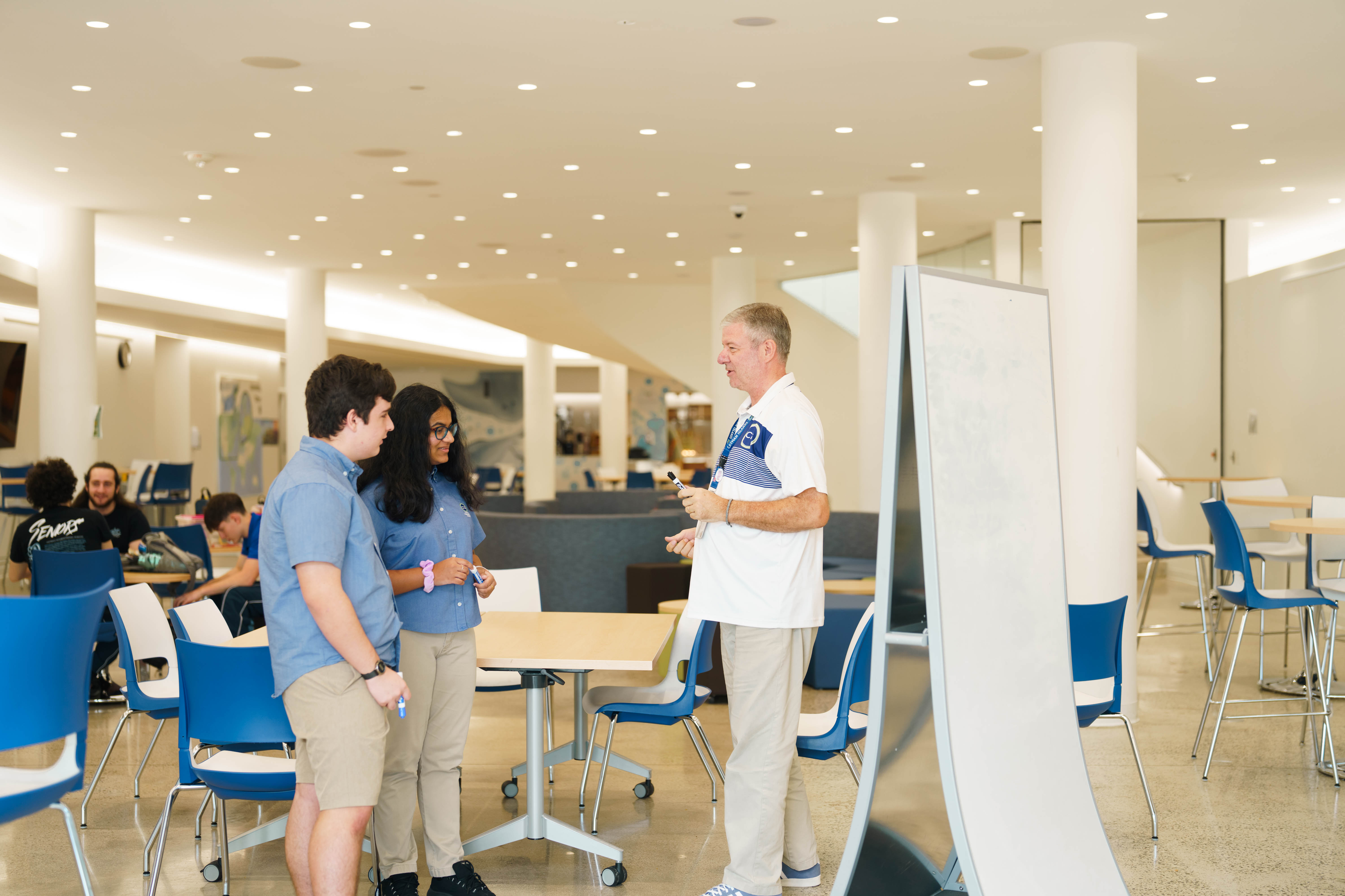 Teacher talking to students