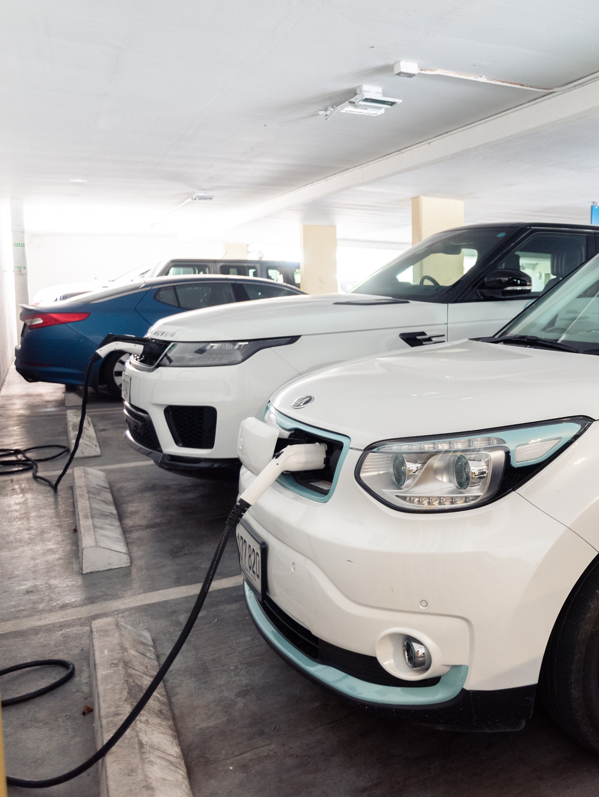 White car at charging station